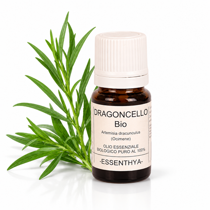 Flacone di olio essenziale di Dragoncello Bio da 5 ml accanto a foglie e rametti di dragoncello — Artemisia dracunculus